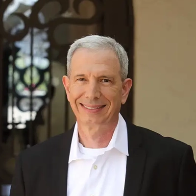 Orthodontist Shawn Bader Smiling In Suit